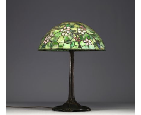 TIFFANY STUDIOS â€˜New Yorkâ€™ 1900 - Table lamp with bronze base and floral glass mosaic shade,&nbsp;signed and numbered und