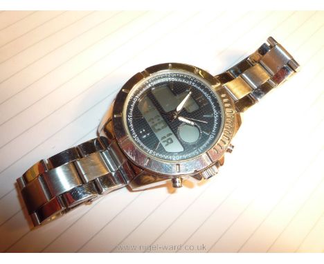 A heavy polished finish ''Executive Elite'' quartz movement Wristwatch having black grid pattern face with luminous hands and