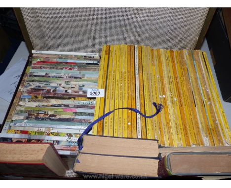 A vintage case of 50's National Geographical and 60's Readers Digest magazines.