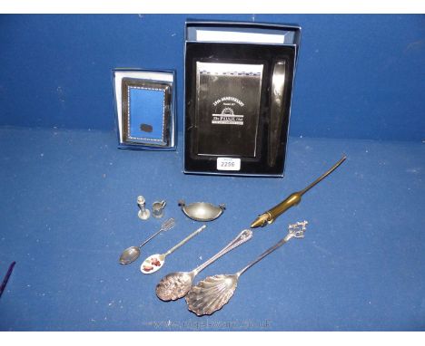 A small boxed silver plated 4 3/4" x 3 1/2" photo frame, a 25th anniversary note pad and paper knife 'The Posh Club' together