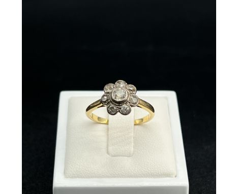 An 18ct yellow gold Victorian cushion cut diamond daisy ring,
unhallmarked but tested 18ct,
approx 0.75ct diamonds,
size P,
3