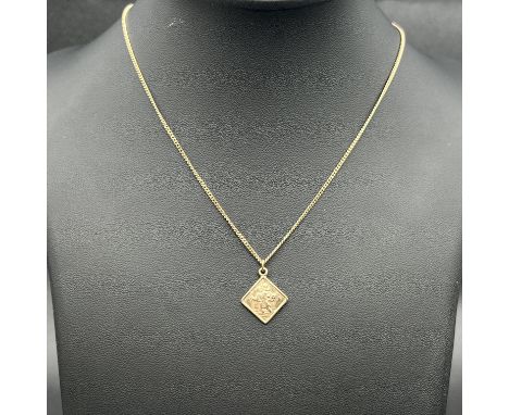 A 9ct yellow gold St Christopher pendant and chain,
both are hallmarked,
chain is 16 inches long,
pendant is 18mm x 15mm,
3.8