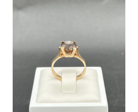 A 9ct yellow gold quartz / cairngorm single stone ring,
size N,
2.72 grams in weight,