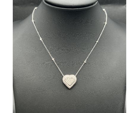 An 18ct white gold full diamond heart pendant and chain,
diamond is set into the chain and fully incrusted by round brilliant