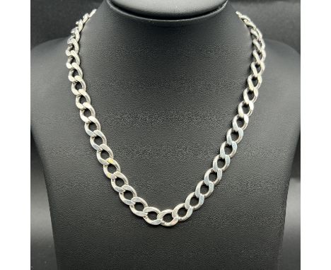 A solid silver curb chain,
18 inches long,
nice condition,
63 grams in weight approx,