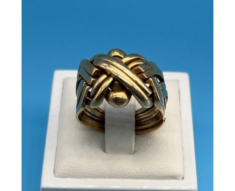 A 9ct yellow gold puzzle ring,
8 piece puzzle ring,
size R,
ring has a keeper on it to keep it together as there is some dama