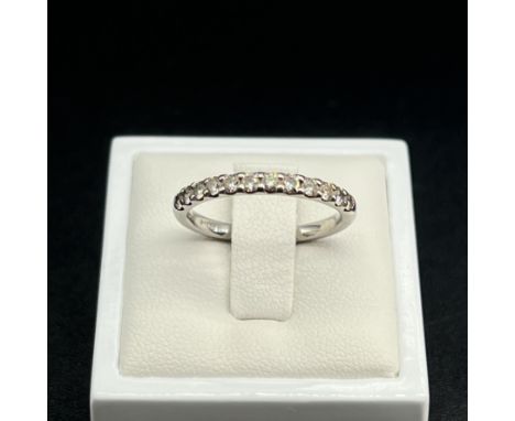 A platinum half eternity ring,
hallmarked 900 platinum,
set with 12 diamonds approx 0.30ct,
4 grams in weigth approx,
size O