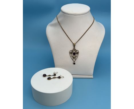 A 9ct yellow gold Victorian pendant with amethyst and seed pearl and matching earrings,
16 inch chain,
45mm x 20mm pendant,
e