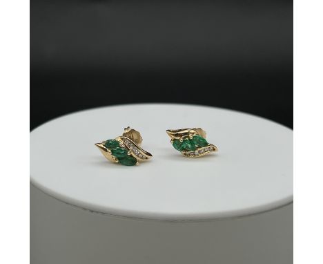 A 14ct yellow gold Columbian emerald and diamond stud earrings,
2.58grams in weight,
marques emeralds and a row of diamonds,