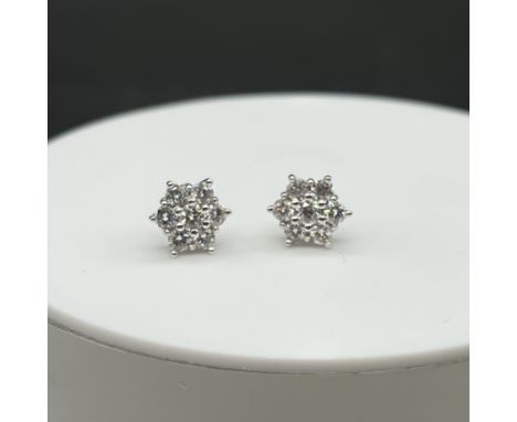 A pair of 18ct white gold 7 stone daisy diamond stud earrings,
each earrings approx 0.50ct,
no butterflies,
earrings in nice 