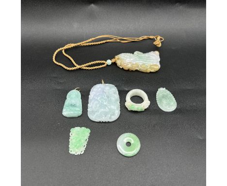 A mixed collection of Jade items, largest piece is 3 inches x 1 1/2 inches, mixed grades of quality