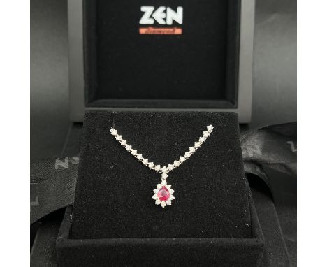 14ct white gold ruby and diamond necklace,
5.57 grams,
set with pear shaped medium to dark cerise coloured ruby,
ruby is 6mm 