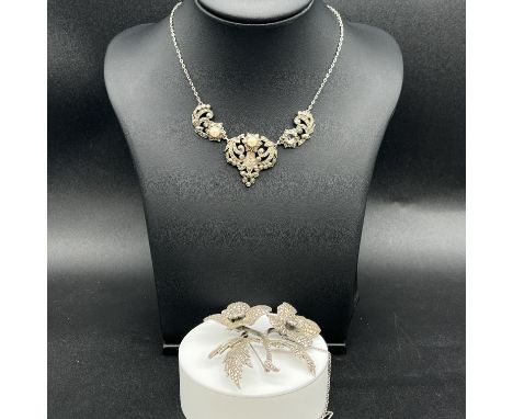 A silver marques pendant and chain and a large marques brooch,
48.9 grams in weight approx,
large brooch is 2 1/2 inches x 2 