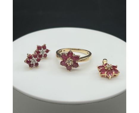 A 14ct yellow gold ruby and diamond daisy ring,
size L,
daisy stud earrings,
daisy pendant no chain,
very nice condition,
6.8