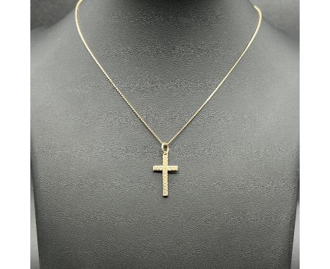 A 9ct yellow gold cross pendant and chain,
18 inch long chain,
hallmarked,
weight is 3.7 grams approx
