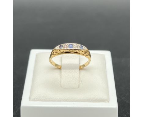 A Victorian 18ct yellow gold ring with sapphire and diamonds,
1.56 grams in weight,
Size K,