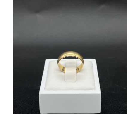 An 18ct yellow gold wedding band,
solid band,
size K,
5mm wide,
4 grams in weight