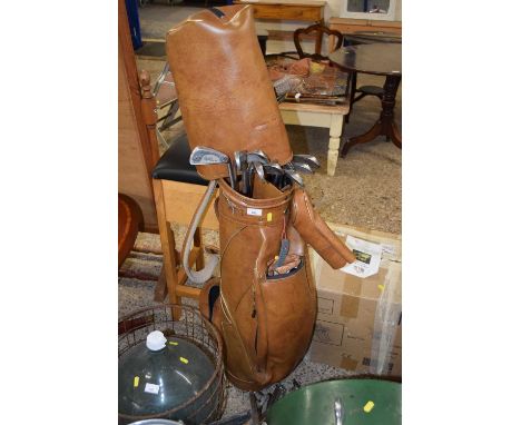 Case of mixed vintage golf clubs