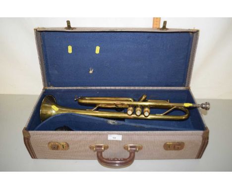 Vintage brass trumpet marked 'Cadet' with case