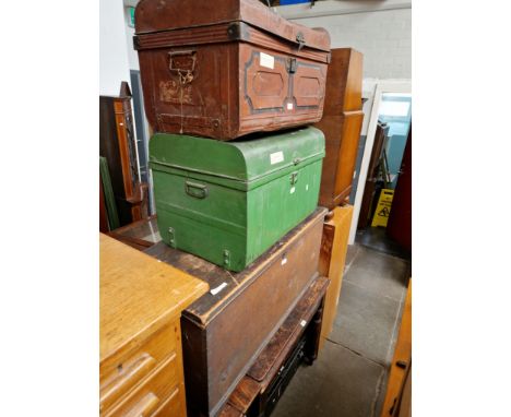 Various items of furniture, a stained pine table, a Victorian pine blanket box, two vintage tin trunks and a tin box. 