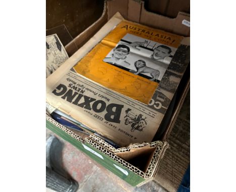 A box of sporting memorabilia. 