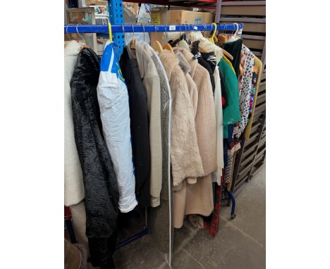 A clothes rail of vintage ladies clothes including dresses, coats, jackets - Peter Barron, Franco di Tardo, Moss Bros etc RAI