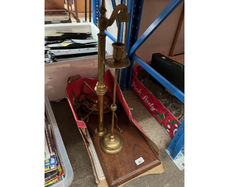 A vintage Wilcock &amp; Sons Preston brass balance on wooden base, with brass trays and weights together with a candle holder