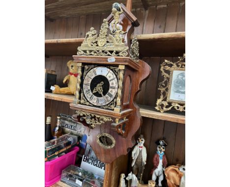 A large Dutch wall clock with weights, bearing name Nue Elck Syn Sin 