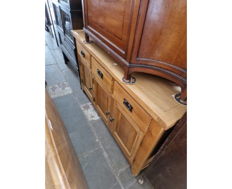 A modern light oak sideboard. Dimensions- height 82.5cm, width 135cm and depth 40cm.Condition- there are some marks to the to