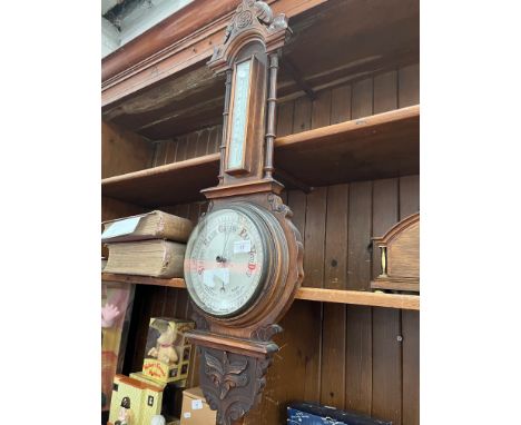 An oak barometer/thermometer 