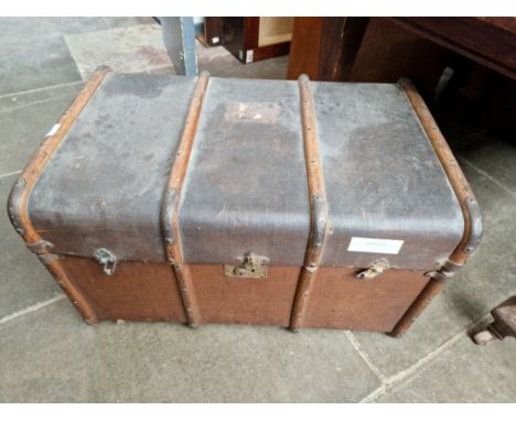 A vintage beech bound steamer trunk. 