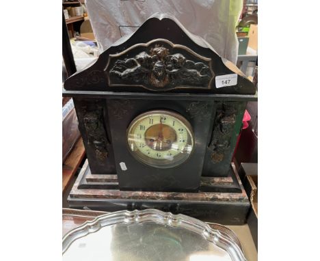 A large Victorian slate mantel clock with enamelled face, no pendulum and no key. 