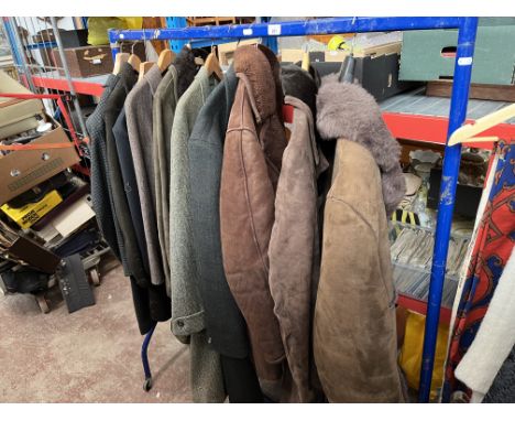 A clothes rail containing ladies and gents coats, jackets, including sheepskin, wool, suede, Marlsboro, formal hunting attire