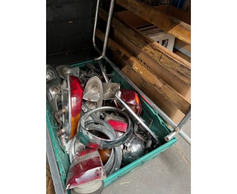 A box of vintage car parts, mostly MGB including luggage rack. 