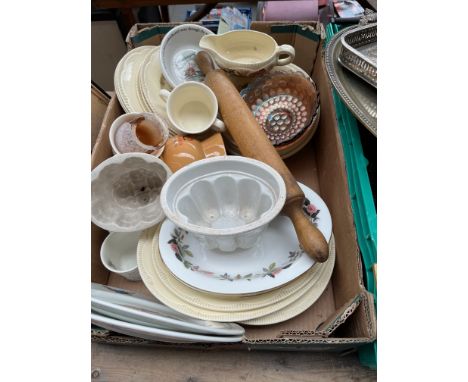 A box of miscellaneous pottery, jelly moulds, Bunnykins sets, Wedgwood Peter Rabbit, Glenmorangie water jug, Clarice Cliff sa