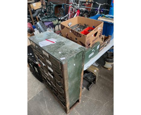 A metal multi drawer cabinet and three boxes of tools 