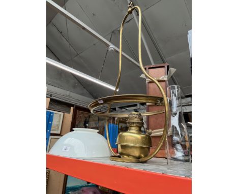 A brass ceiling oil lamp with milk glass shade and funnel, height approx. 95cm. 