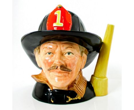 Style One. Black, brown and red helmet badge.Launched exclusively by Griffith Pottery House in 1983, The Fireman jug was then