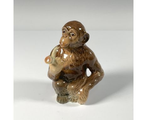Hand painted monkey holding a smoking pipe. Gloss finish. Backstamp Beswick England in black. Impress mark Beswick 1049. Issu