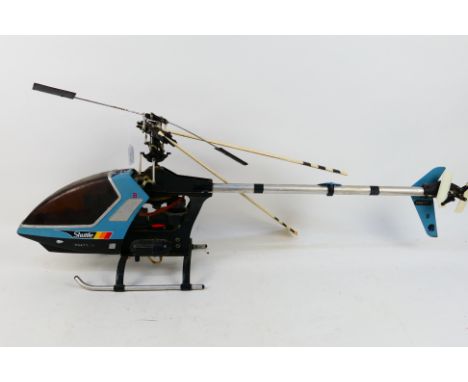 A large scale nitro Hirobo RC 'Shuttle' helicopter. The aircraft measures approximately 125 cms (L) x 37 cms (H), and shows s