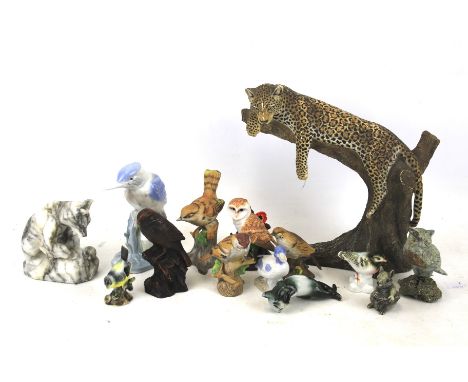 Fourteen ceramic models of animals. Comprising birds, a cat, bear and a leopard, tallest H26cm