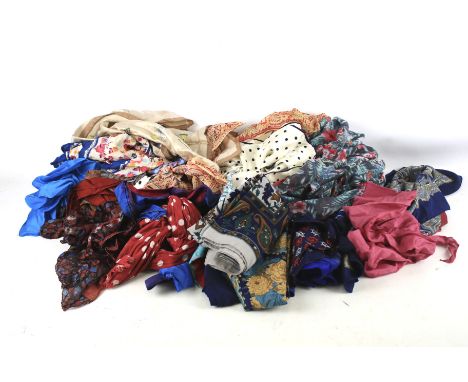 A collection of vintage scarves. Including silk and cotton examples, in a variety of sizes and patterns