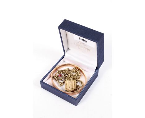 An early 20th century 9ct rose gold hollow rectangular-section bangle and other items. The first 7.2g, together with a shield