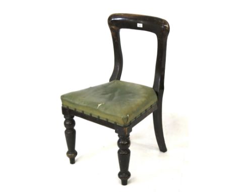 A Southern Rail waiting room chair and LMS ceramic teacup. The chair with a wooden frame, hooped back, and green leather upho