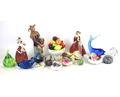 An assortment of ceramics and glassware. Including three Royal Doulton figures, a Wedgewood paperweight, Adderley porcelain f