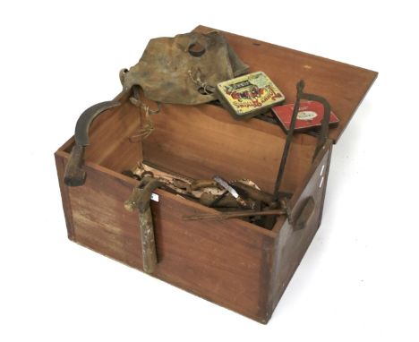 A vintage wooden tool box and contents. Including hammers, chisels, saws, etc, the box with handles to either side, measuring