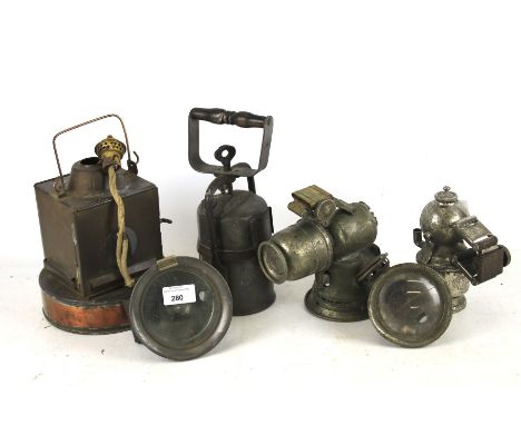 Five assorted spirit and carbide railway and cycle lanterns. Including a copper example stamped 'B.R.W.' H19cm, 'Premier Lamp