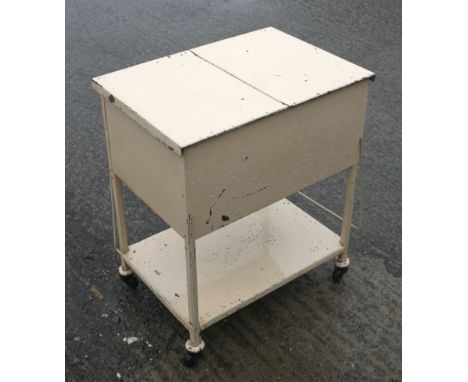 A vintage enamel trolley. With a sliding top and undertier, 66cm x 45cm x 75cm