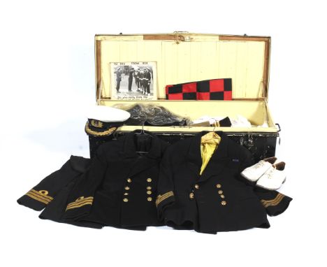 An officer's Naval Air Service metal uniform trunk and contents. Including uniforms, coats, jackets, caps, trousers, footwear