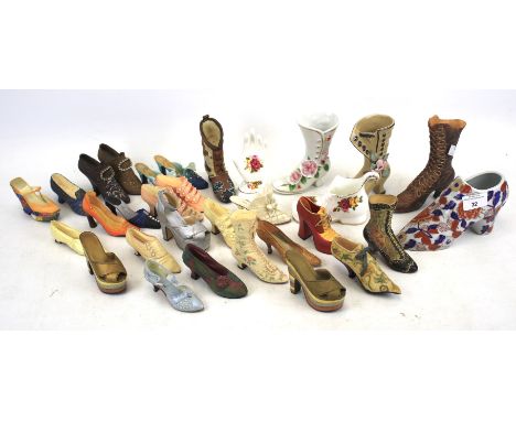 A collection of miniature model shoes. Including ceramic and resin examples, several by 'Just The Right Shoe', largest H12cm